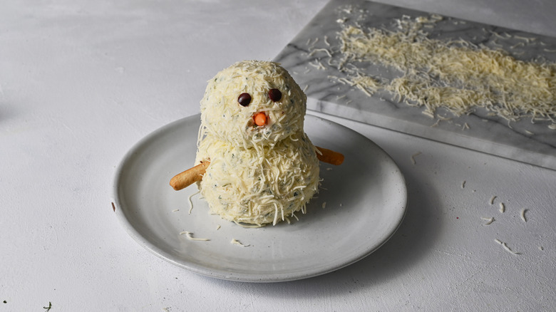 snowman cheese ball on plate