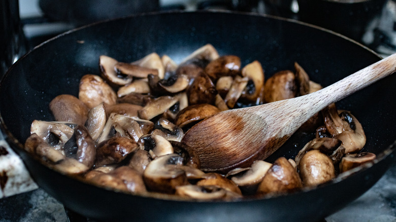 Mushrooms sauteing in pan