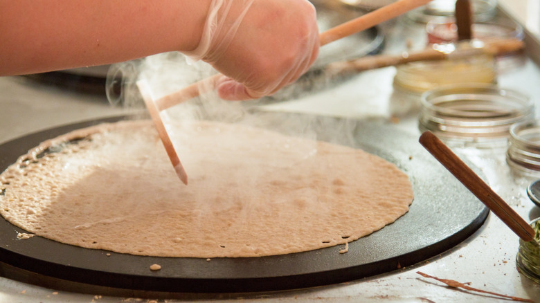 Making crepes in pan