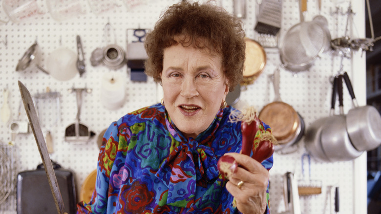 Julia Child with knife and peppers