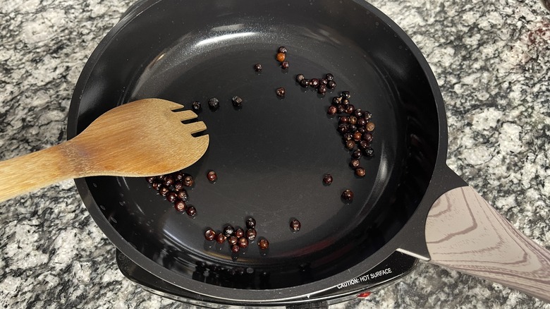 toasting juniper berries in pan