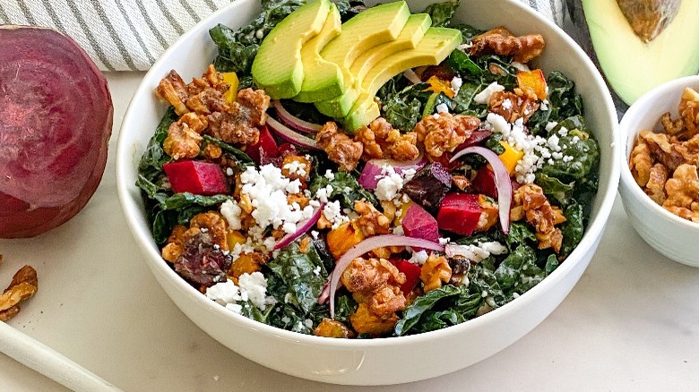 large white bowl with kale and beet salad