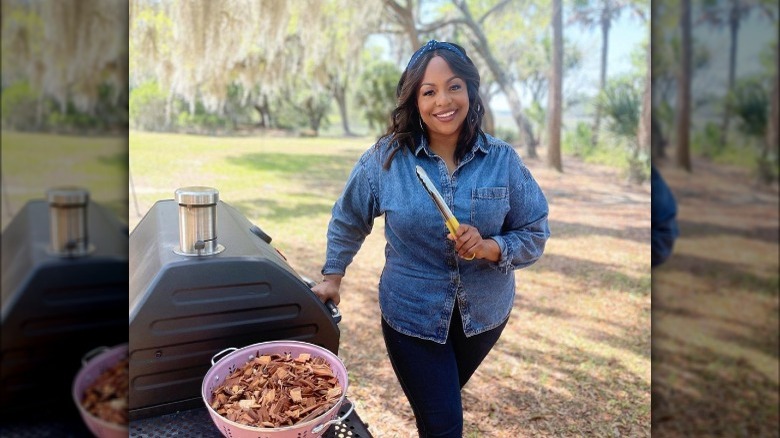 Kardea Brown grilling outside