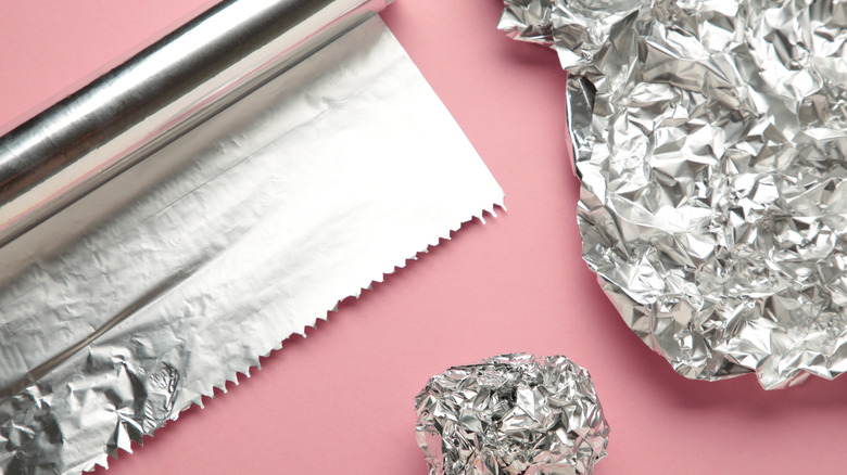 Aluminum foil on pink background