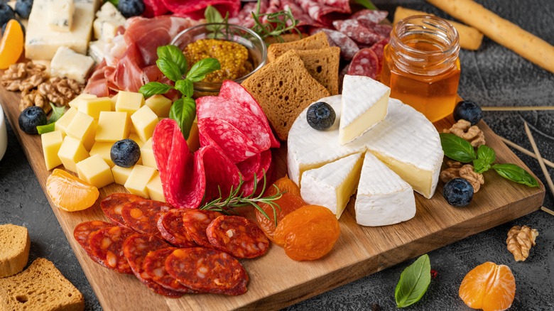 snack board with meat, cheese, and fruit