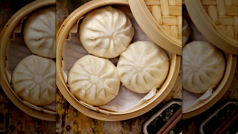 Dumplings in parchment-lined steamer basket