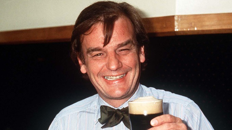 Keith Floyd holding a beer 