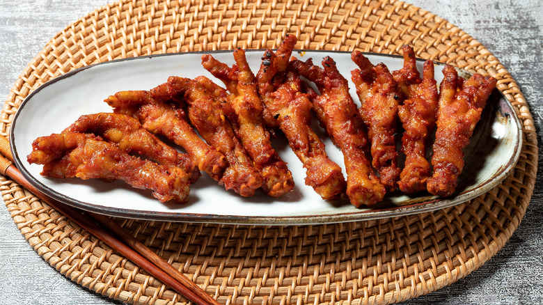 cooked chicken feet coated in sauce