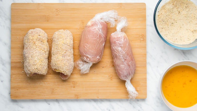 chicken rolls on cutting board