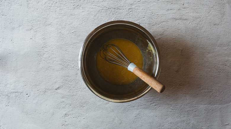 Liquid in a bowl with whisk