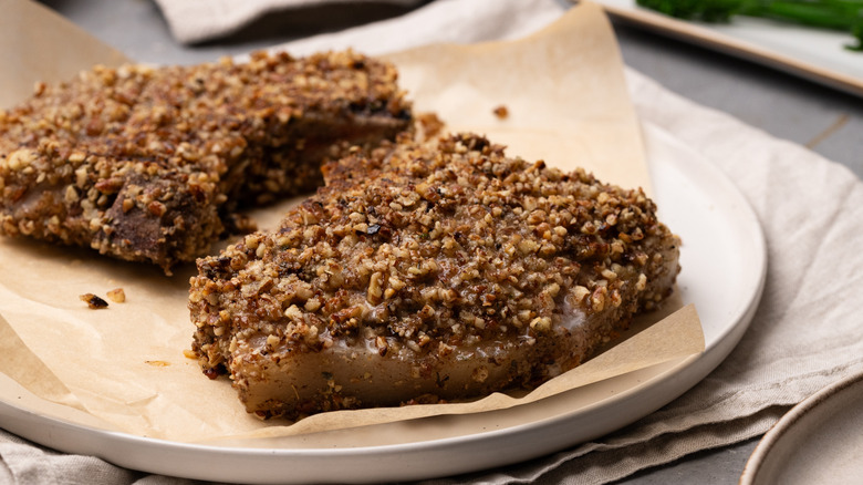 serving pecan-crusted pork chops