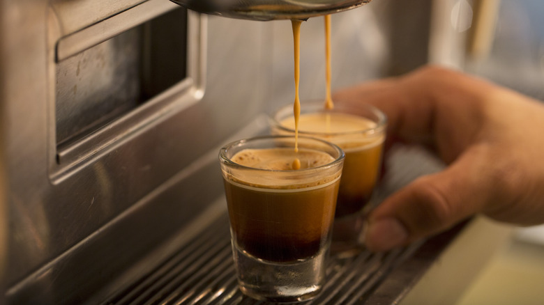 Pouring two espressos