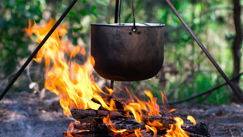 Cast iron pot over flame