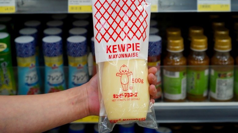 hand holding kewpie bottle