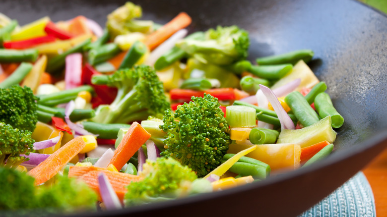 colorful raw vegetables in wok 