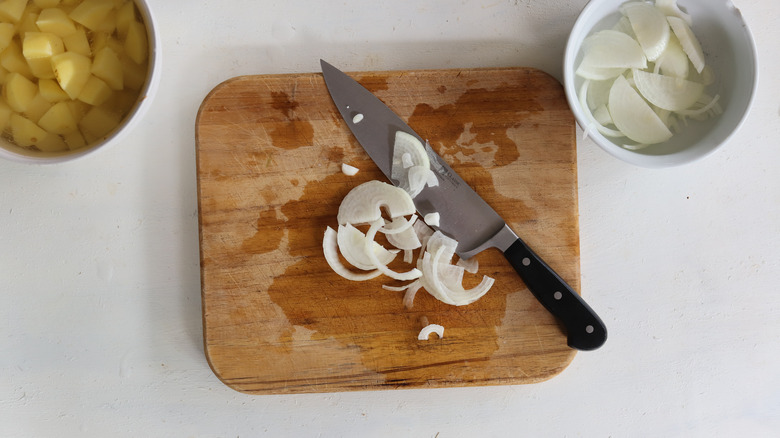 sliced onions on cutting board