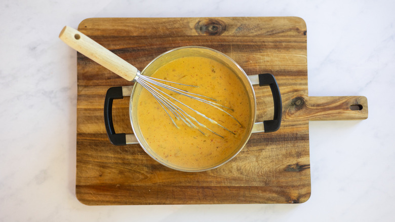 cheese sauce with whisk