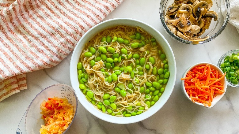 ramen ingredients and white bowl