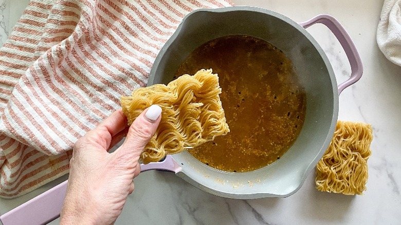 ramen and broth in pot