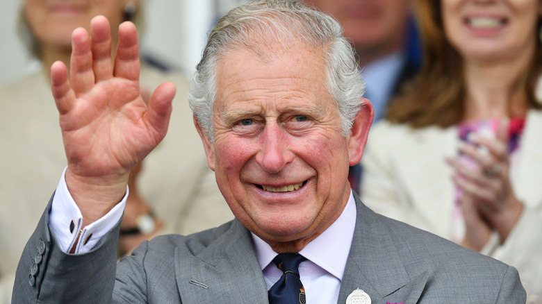 King Charles III waving