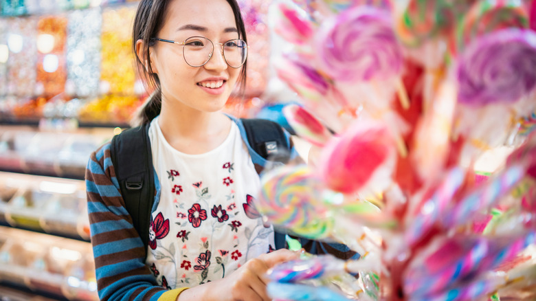 Asian woman in a candy store 