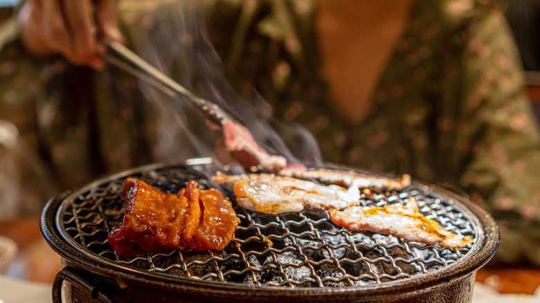 korean bbq meat on charcoal