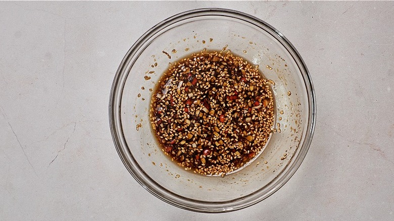 bowl of sauce with sesame seeds