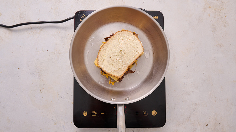 toasting sandwich in skillet