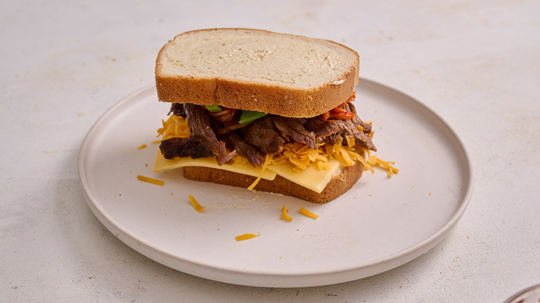 Grilled cheese stacked on plate