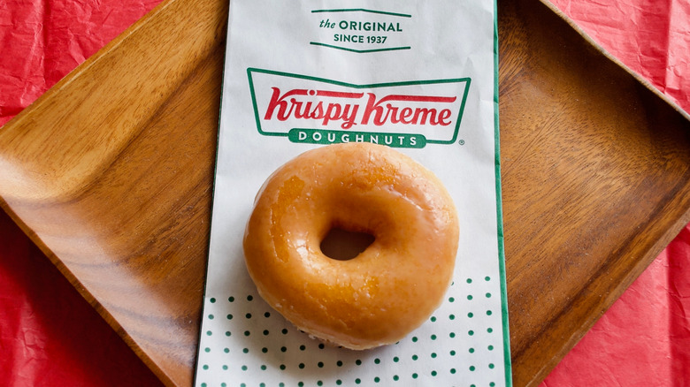 Krispy Kreme glazed donut on bag