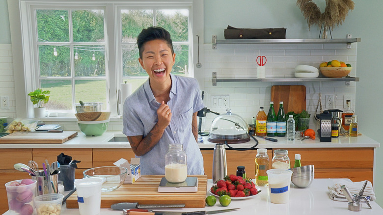 Kristen Kish laughing in the kitchen