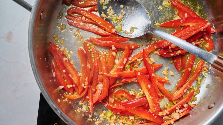 peppers cooking in pan