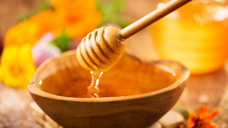 Honey in wooden bowl