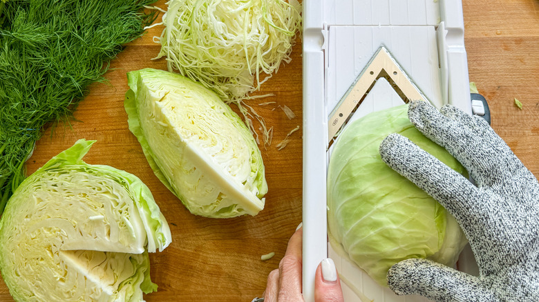 hand slicing cabbage with mandoline