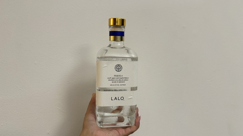 Clear tequila bottle with white label