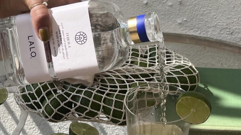 Lalo Tequila being poured into glass