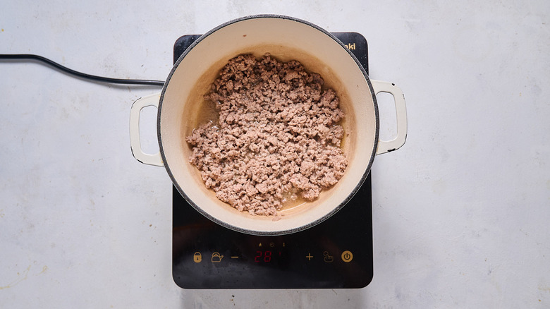 cooking lamb in pot