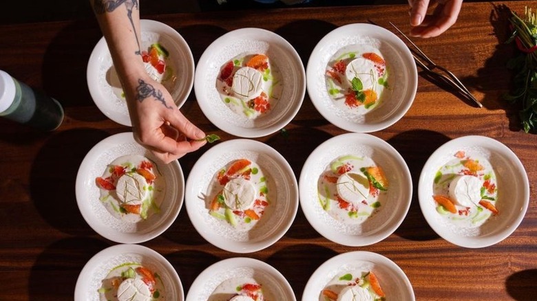 dishes being plated at Langbaan