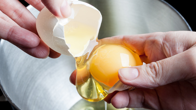 Person separating eggs