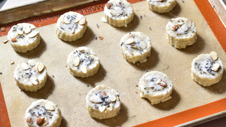 adding sugar and almonds to scones