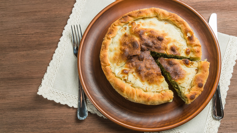 Spanakopita pot pie with slice cut