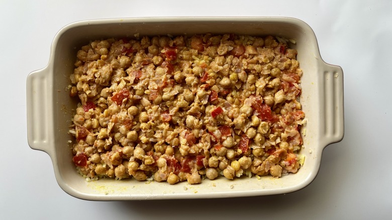 mashed chickpeas and tomatoes in a baking dish