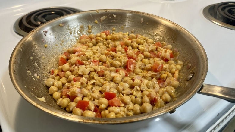 chicken and diced tomato in a skillet