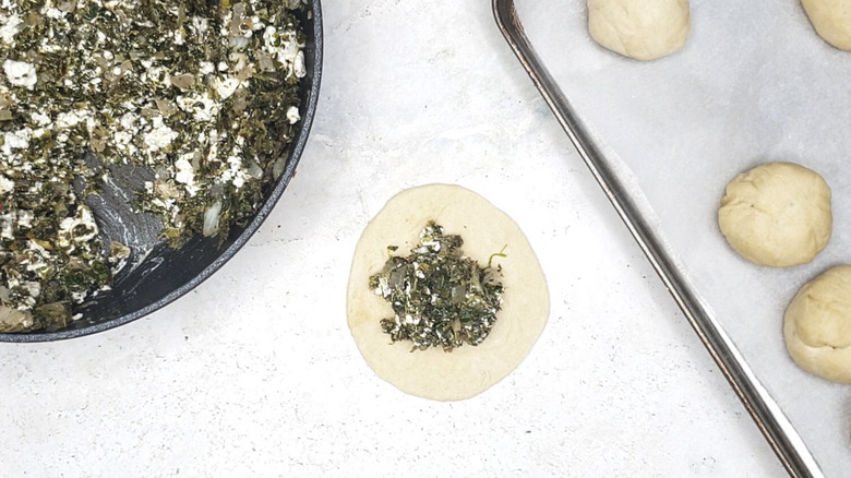 Spinach filling on dough