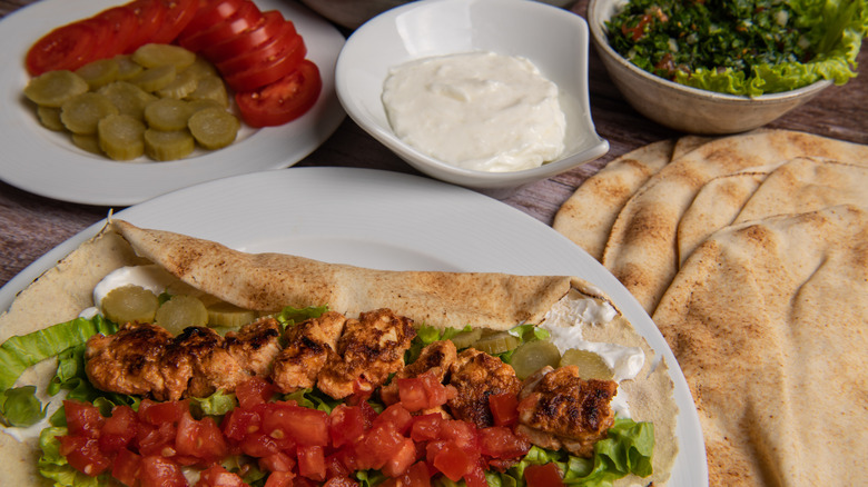 toum served with lebanese meat and pita dish