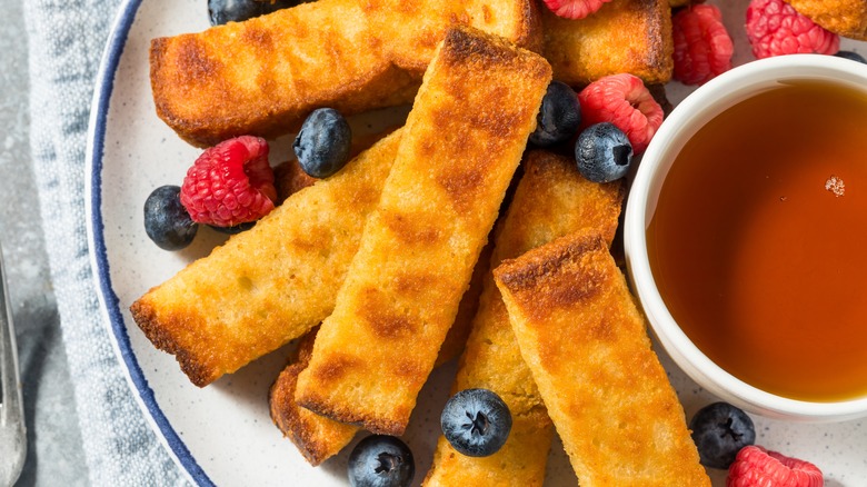 Sticks with berries and syrup