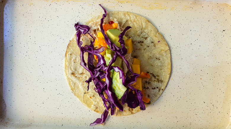 Assembled taco on baking sheet