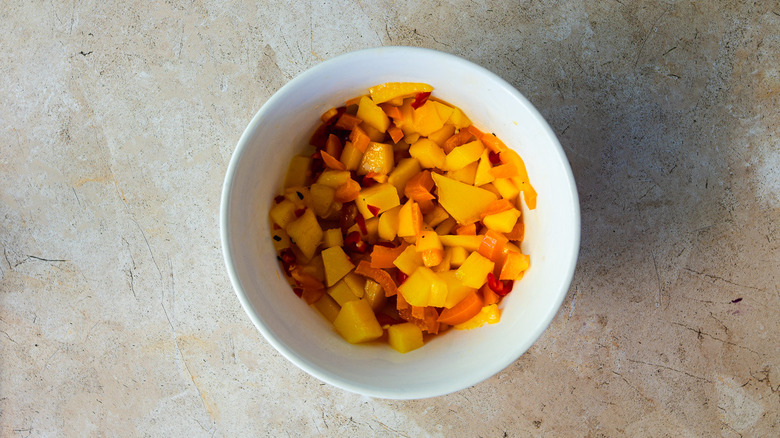 Mango salsa in white bowl