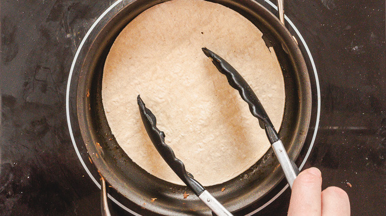 Toasting tortilla in pan