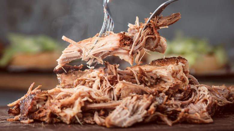 Shredding pulled pork with forks